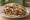 Kalb Döner: an illustration of veal, beef, onion, tomato and more.