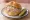 Kalbsleberwurst Brötchen: an illustration of onion, mustard and pickle on kaiser roll.