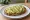 Kanapka z Awokado: an illustration of avocado, lemon and pepper on bread.