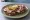 Kanapka z Karkówką: an illustration of butter, pork, mustard, horseradish and more on bread.