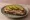 Kanapka z Pasztetem i Ogórkiem: an illustration of butter, pâté and pickle on bread.