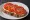 Kanapka z Pomidorem: an illustration of butter, tomato and pepper on bread.