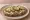 Kanapka z Smalcem i Ogórkiem: an illustration of pickle and onion on bread.