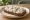 Kanapka ze Śledziem w Śmietanie: an illustration of herring, sour cream and onion on bread.