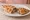Kapalı Pide: an illustration of beef, onion and parsley on pita.