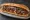 Karışık Izgara Ekmek: an illustration of beef, lamb, chicken, onion and more on bread.
