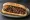 Kasap Köfte Ekmek: an illustration of beef, onion, tomato, parsley and more on bread.