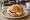 Käse-Marmelade Brötchen: an illustration of cheese, jam and butter on kaiser roll.