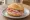 Kasseler Brötchen: an illustration of mustard and butter on kaiser roll.