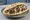 Kebab Keves (קבב כבש): an illustration of lamb, onion, parsley and tahini on pita.