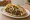 Kebab Meurav (קבב מעורב): an illustration of beef, lamb, onion, parsley and more on pita.