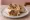 Kebab w Cieście: an illustration of beef, cabbage, onion, tomato and more on pita.