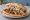 Kebab z Sosem Łagodnym: an illustration of beef, chicken, cabbage and onion.