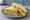 Kedgeree Sandwich: an illustration of egg, rice, curry powder and butter on white bread.