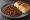 Keema Pav: an illustration of mutton, onion, tomato, ginger and more on bread.