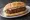 Keppe: an illustration of beef and onion on baguette.