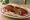 Kibbeh Makli (كبة مقلية): an illustration of lamb and onion on pita.