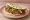 Kibbeh Nayyeh Sandwich (كبة نية): an illustration of lamb and onion on pita.