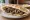Kibdeh Makli (كبدة مقلية): an illustration of lamb and onion on pita.