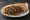Kibdeh Meshwi (كبدة مشوية): an illustration of lamb and onion on pita.