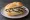 Kieler Sprotten Brötchen: an illustration of herring, butter and onion on kaiser roll.
