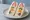 Konbini Fruit Sando (コンビニフルーツサンド): an illustration of whipped cream, strawberry, kiwi and orange on shokupan.