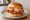 Korean-American Fried Chicken Sandwich: an illustration of chicken, gochujang, kimchi, radish and more on burger bun.