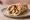 Kotopoulo Lemonato se Pita: an illustration of chicken and lemon on pita.