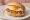 Krabben mit Spiegelei: an illustration of shrimp, egg and butter on kaiser roll.