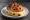 Krentenbollen met Kaas: an illustration of cheese and butter.