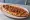 Kuşbaşılı Pide: an illustration of lamb, beef, onion and tomato on pita.