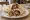 Kuzu Pirzola Dürüm: an illustration of lamb and onion on pita.