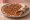 Lahm b'Ajeen (لحم بعجين): an illustration of beef, lamb, onion, tomato and more on pita.