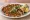 Lahmacun Acılı: an illustration of lamb, tomato, onion, parsley and more.