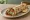 Lahmacun Dürüm: an illustration of lamb, tomato, onion, parsley and more.