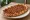 Lahmacunlu Pide: an illustration of lamb, tomato, onion, parsley and more on pita.