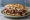 Lamm Döner: an illustration of lamb, onion, tomato, lettuce and more.