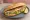 Levrek Ekmek: an illustration of onion, lettuce and lemon on bread.