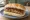 Lincolnshire Sausage Sandwich: an illustration of sausage, pork and butter.
