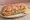 Lobster Grinder: an illustration of lobster, mayonnaise, lettuce, tomato and more on hoagie roll.