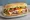 Lomito Completo: an illustration of beef, ham, cheese, egg and more on baguette.