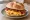 Long Island Bacon Egg and Cheese: an illustration of bacon, egg, american cheese, ketchup and more on kaiser roll.