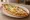 Lorlu Pide: an illustration of egg and parsley on pita.