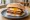 Lorne, Egg, and Tattie Scone: an illustration of beef, pork, egg and brown sauce.