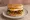 Lotteria — Bibim Rice Burger (비빔 라이스 버거): an illustration of beef, egg, gochujang and lettuce.