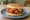 Lotteria — Chicken Gangjung Rice Burger: an illustration of chicken, gochujang, onion, mayonnaise and more.