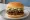 Lotteria — Double Bulgogi: an illustration of beef and bbq sauce on burger bun.