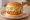 Lotteria — Shrimp Burger (새우 버거): an illustration of shrimp, lettuce, tartar sauce and russian dressing on burger bun.