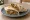 Loubieh Sandwich (ساندويش لوبية): an illustration of tomato, onion and olive oil on pita.