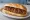 Loukaniko Horiatiko (Χωριάτικο): an illustration of pork and sausage on bread.